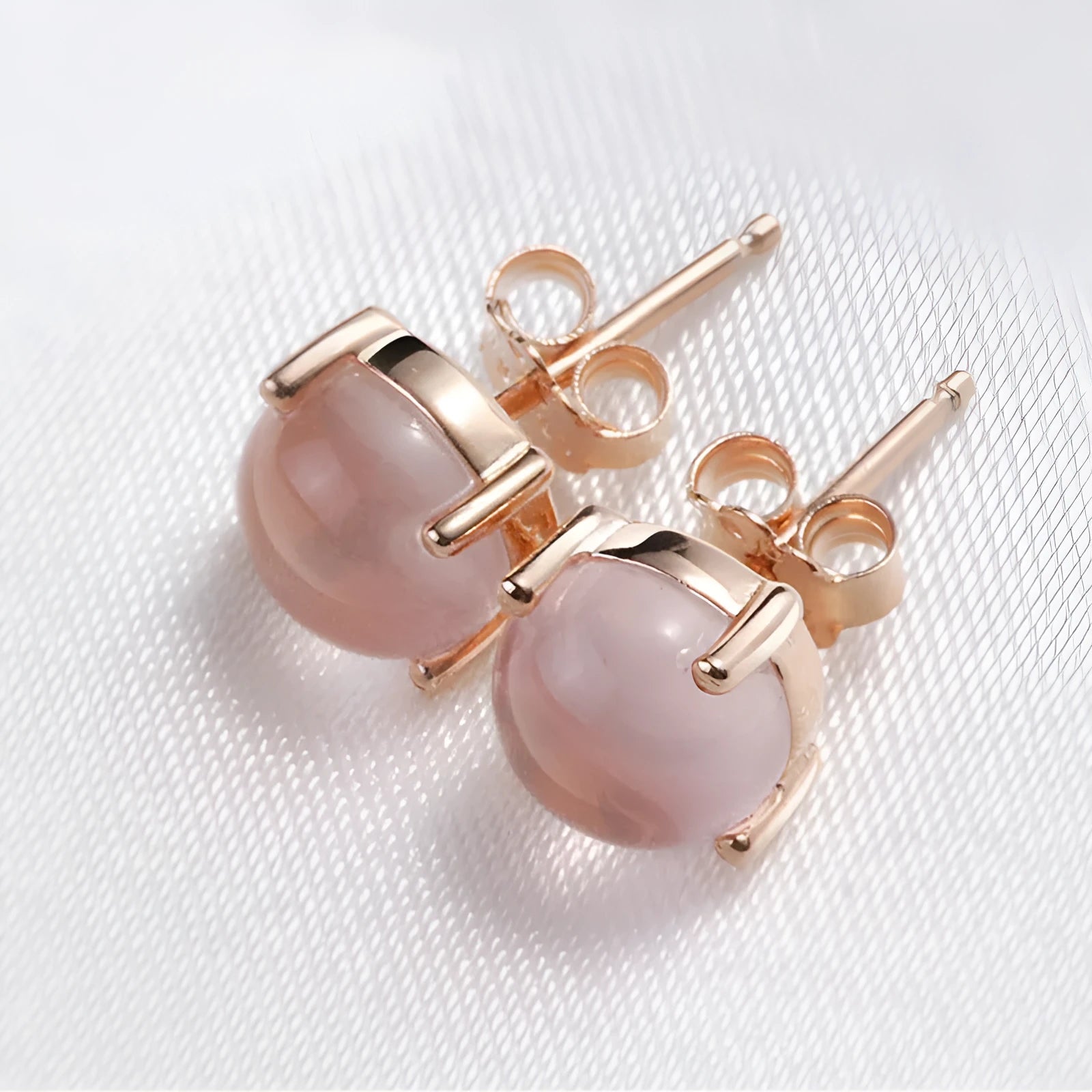 Rose gold drop shape stud earrings with synthetic ross quartz crystal inlay, Korean style.
