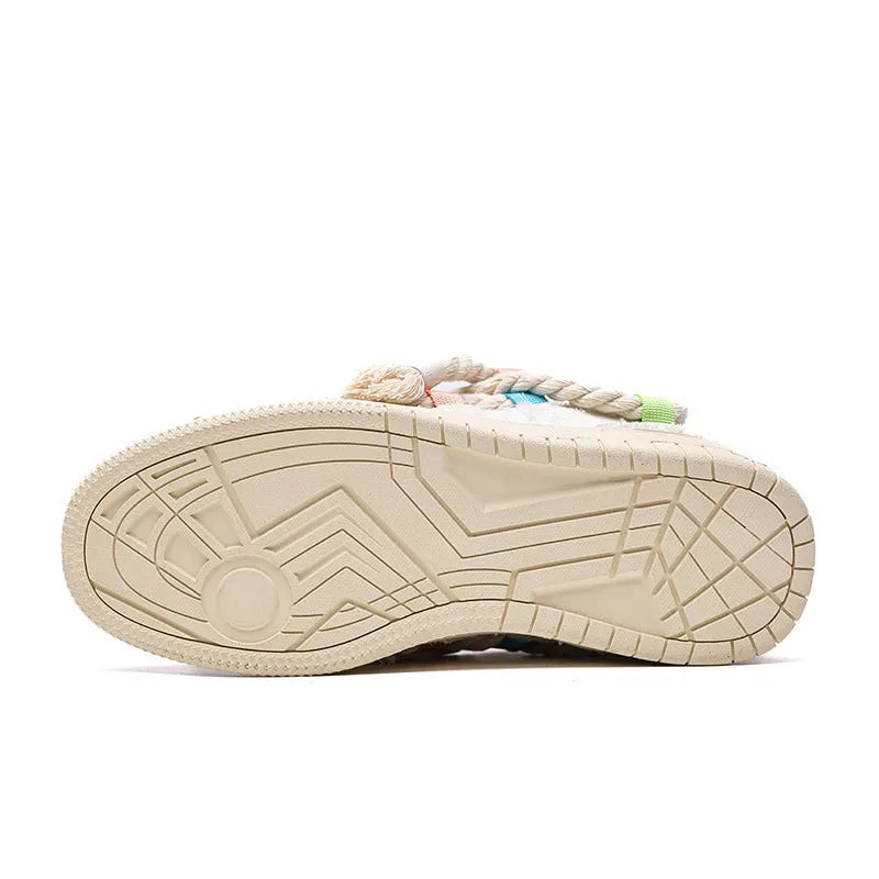 Creamy white Old Damage retro lace-up skateboard shoes with platform sole on a plain background.
