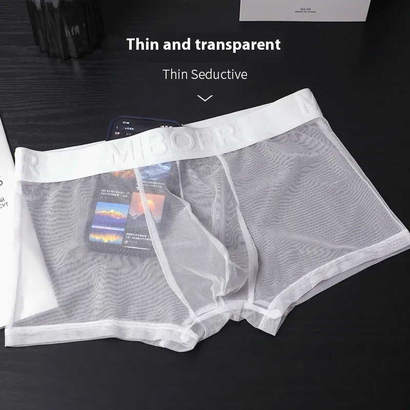 Men's thin invisible breathable boxer shorts in solid colours including black, white, and blue.