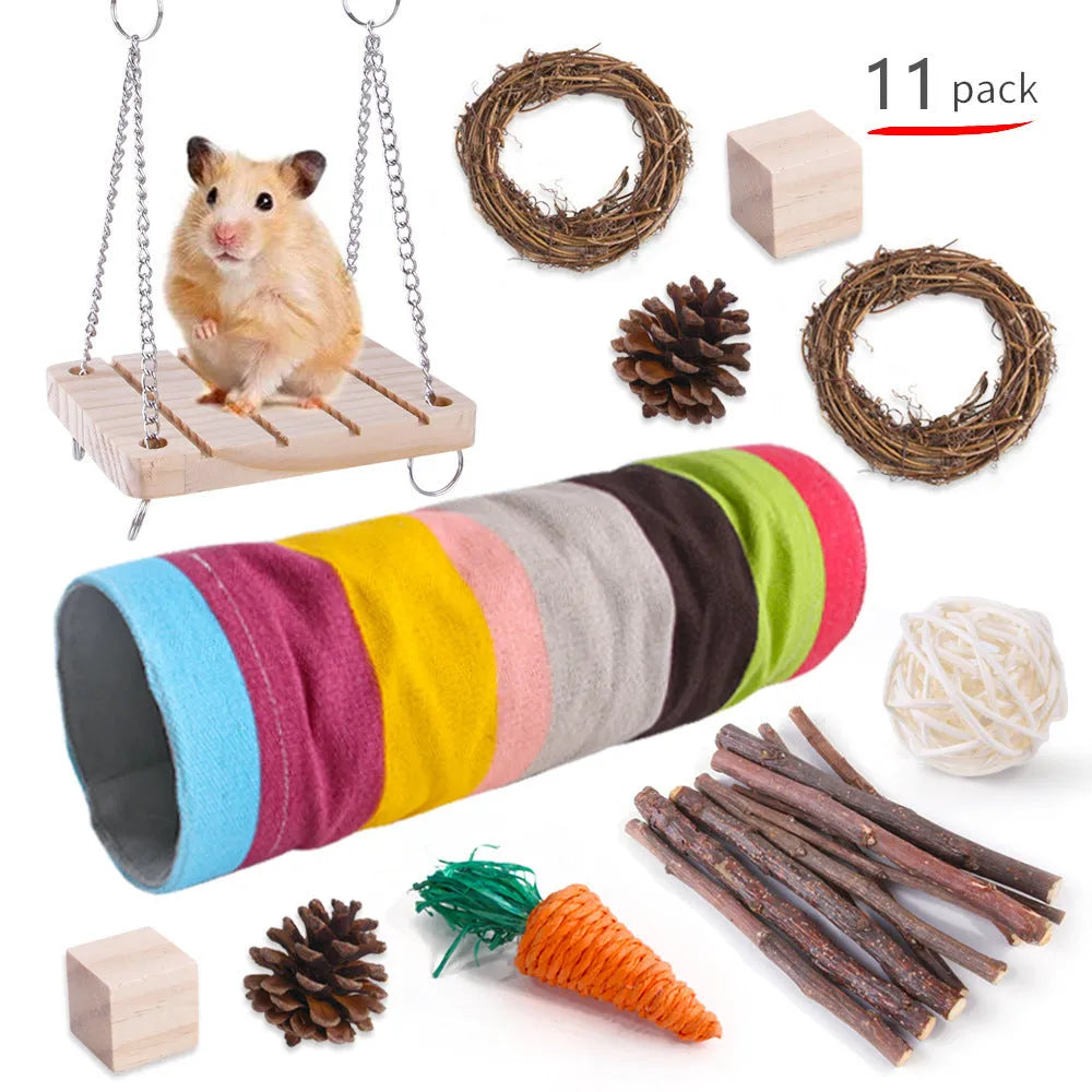 Assortment of wooden and natural fibre chewing toys for pet rabbits, guinea pigs, and parrots on a straw mat