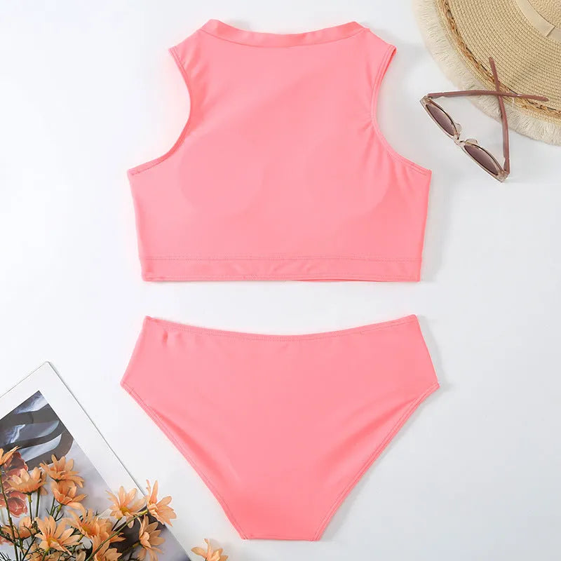 Pink high waist bikini swimsuit with brief style bottoms on a mannequin