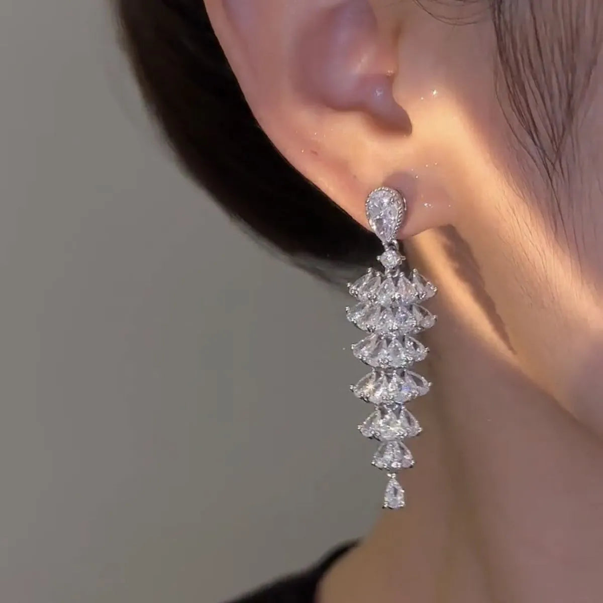 Silver pagoda colour Christmas tree drop earrings with sparkling zircon details on copper studs.