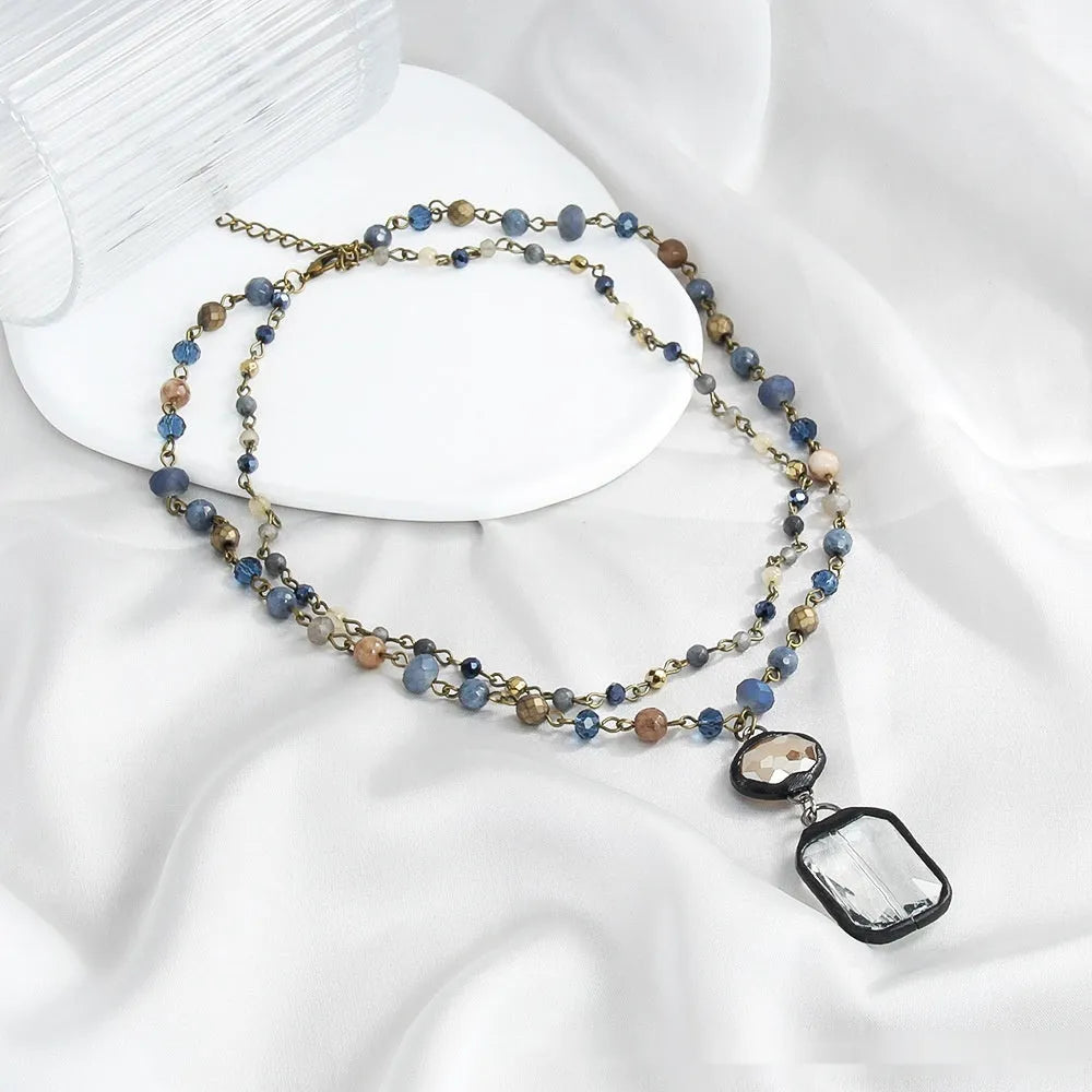 Tribal style two-layer necklace with stone and glass pendant on adjustable chain