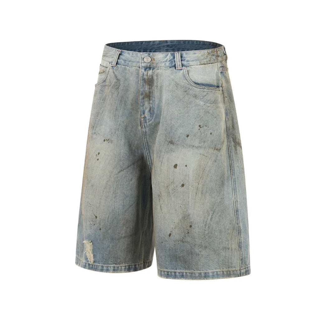 Blue washed denim cropped middle pants with straight leg and zipper fly on a model.