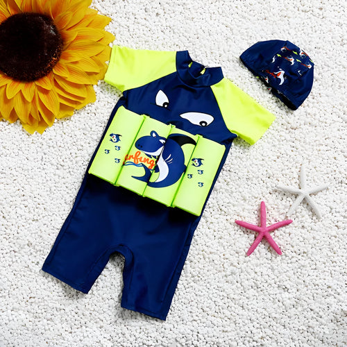 Shark boy patterned buoyancy swimsuit for children in a pool setting.