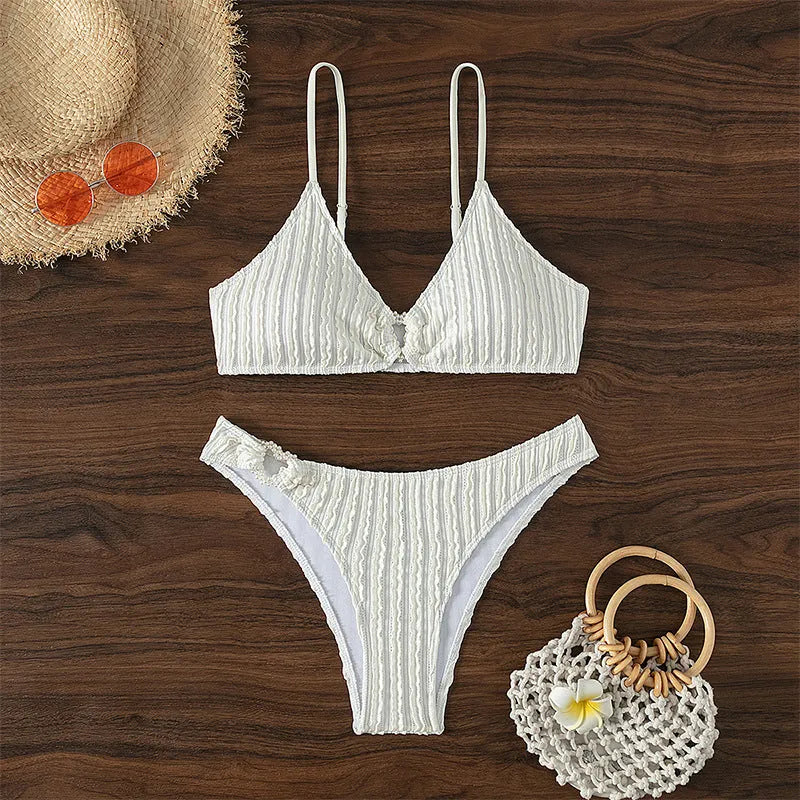 White women's V-neck swimsuit with split leg design and two-piece construction