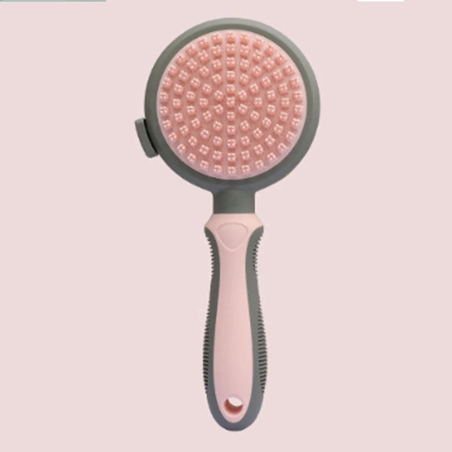 Double-sided cat brush with smooth brush and flea comb on reverse sides, showing release button mechanism