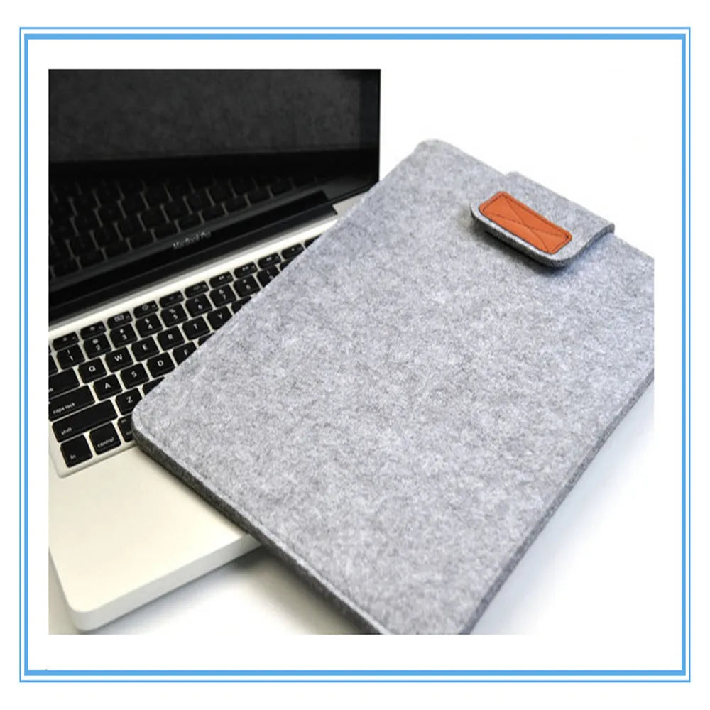 Frosted woven laptop bag with plush felt interior shown open to reveal corner protectors and organised storage