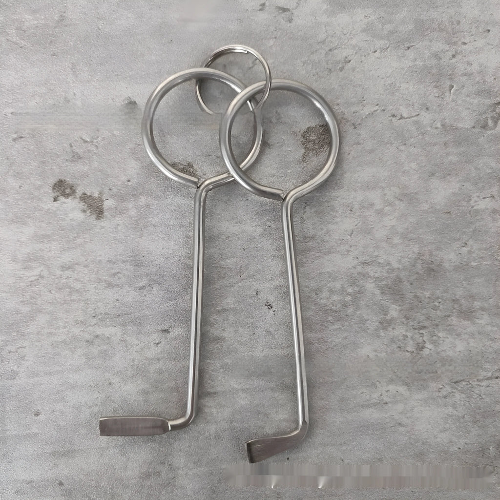 Two alloy steel wrench tools from a portable household repair set.