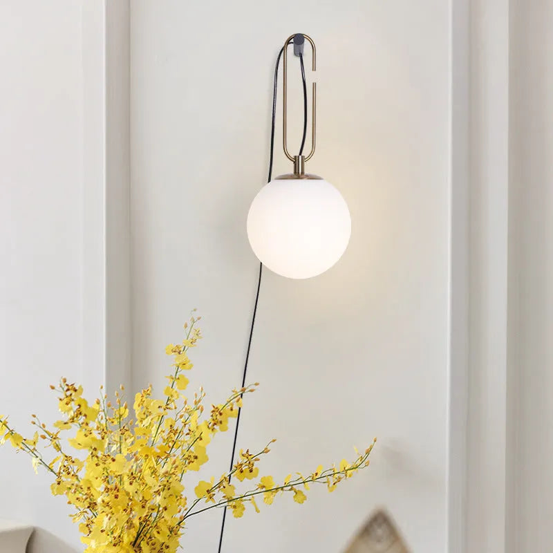 Nordic style modern glass wall lamp showing three selectable light colour temperatures.