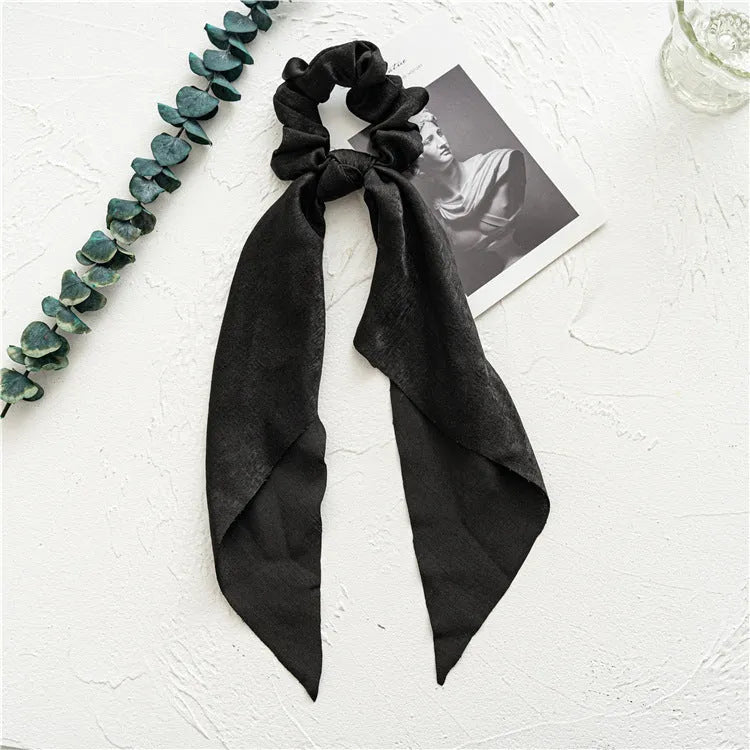 Long ribbon bandeau hair tie with large intestine ring closure in spring dark green cloth fabric
