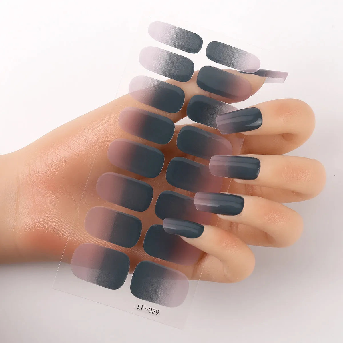 Sheet of 16 solid colour nail art sticker designs including cross, rose, and leopard print patterns.