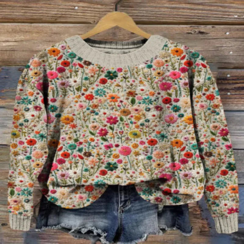 A round neck casual sweater with a small digital floral print, shown in one of thirteen available colours.