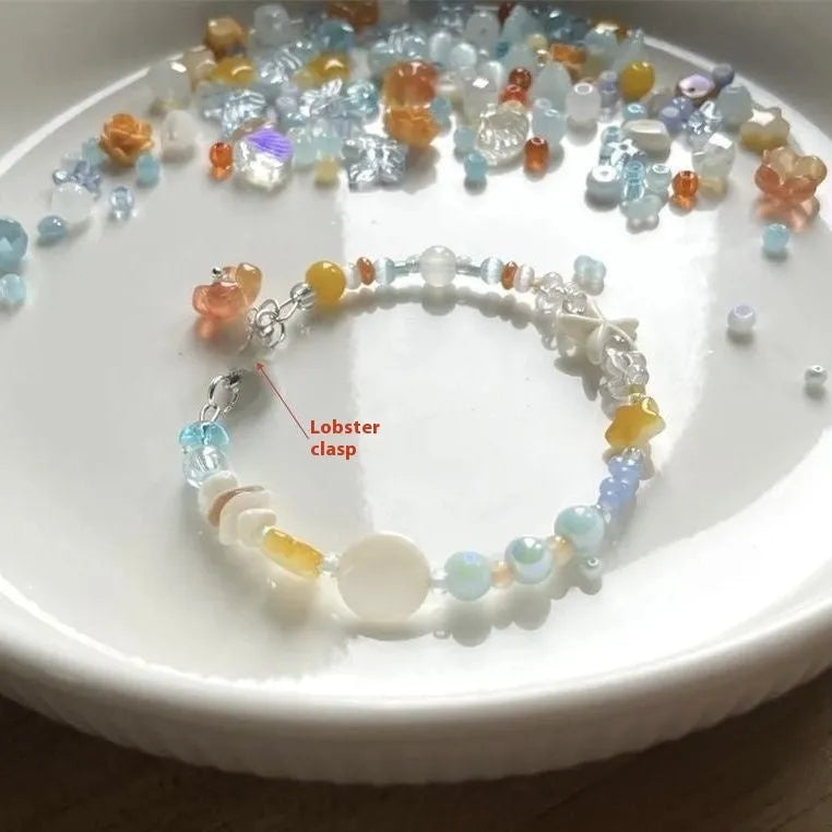 Orange water-soaked colour beach bracelet with diamond-shaped design and round elements