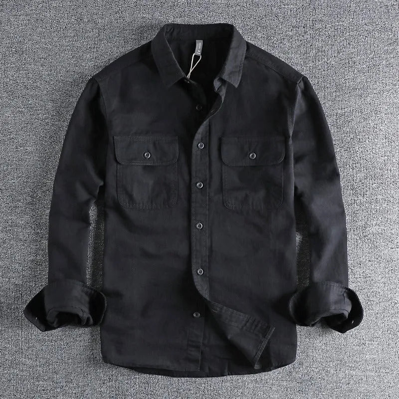 Man wearing a loose fit, long sleeve cardigan-style shirt overall in khaki polyester fabric.