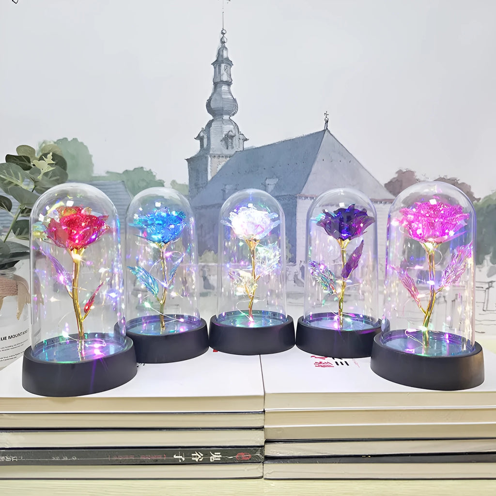 Small plastic night lamp with floral decoration and coloured light options on a black base.