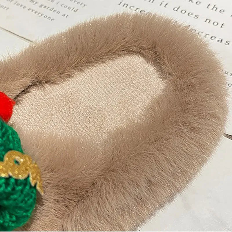Women's Christmas hat slippers in faux plush with a rubber sole.