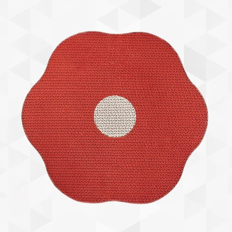Wall mounted cat scratching board with corrugated cardboard surface in home setting
