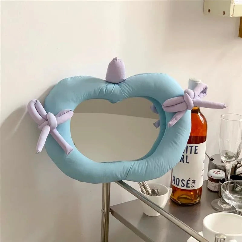 Korean-style decoration mirror with cotton-filled fabric border and aluminium lens in apple colour