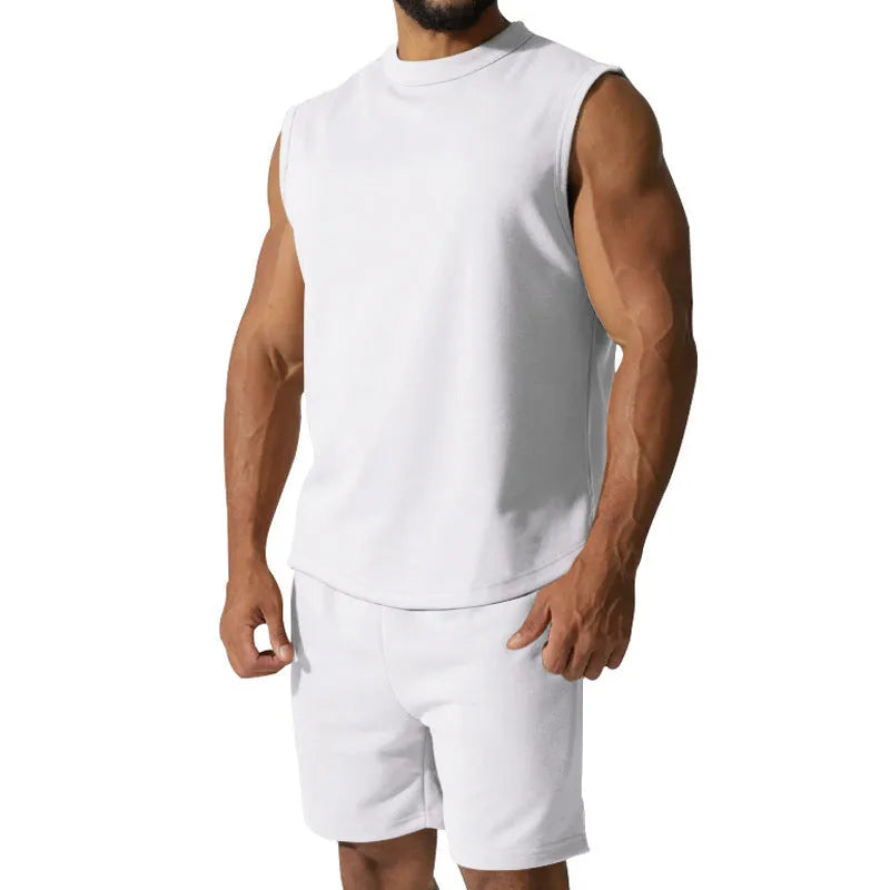 Men's sleeveless cotton blend sports top and shorts set in a solid colour.
