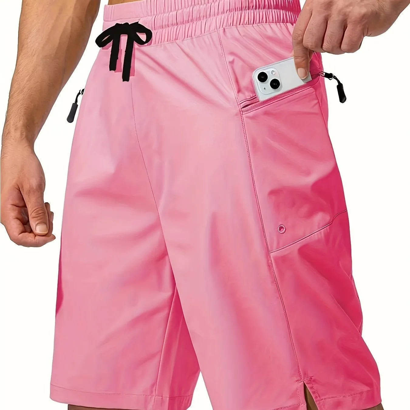Man wearing solid grey quick-drying polyester beach shorts with a straight leg design.