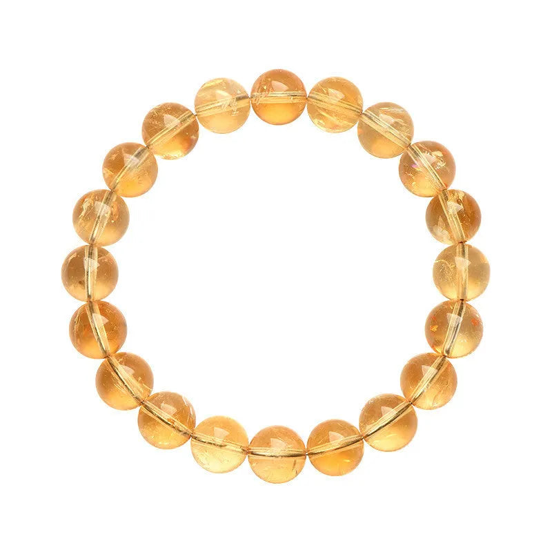 A natural yellow citrine beaded bracelet with geometric stones on a wrist, showing single circle design.