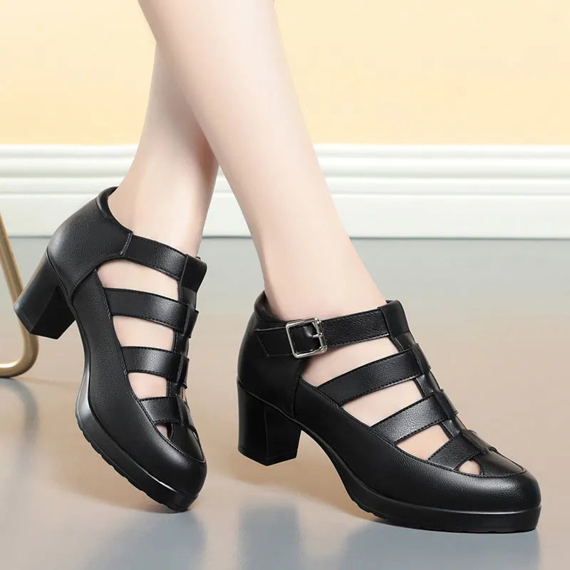 Women's beige closed toe sandals with a chunky heel, woven upper, ankle strap buckle, and back zipper.