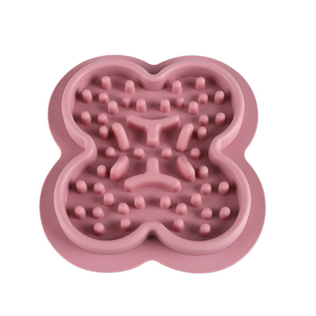 Silicone pet slow feeder licking mat in green colour with textured surface and non-slip base.