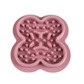 Silicone pet slow feeder licking mat in green colour with textured surface and non-slip base.