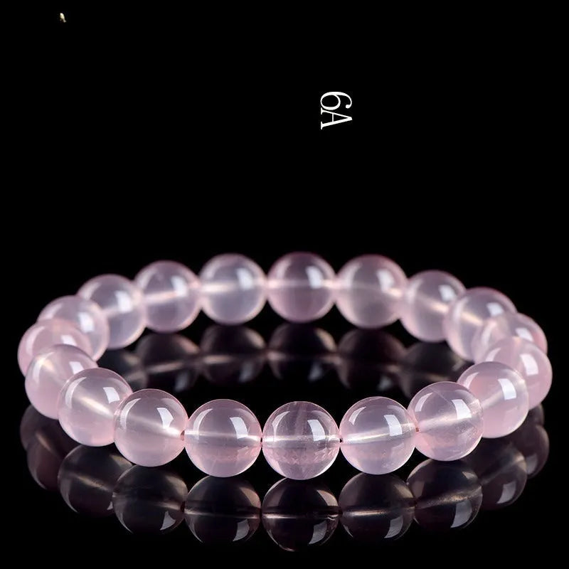 Natural starlight crystal round bead bracelet for women in polished pink with single circle construction