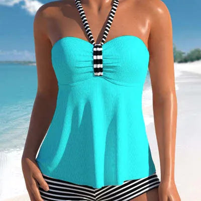 Women's black and white striped off-shoulder swimsuit with briefs cut on mannequin