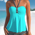 Women's black and white striped off-shoulder swimsuit with briefs cut on mannequin
