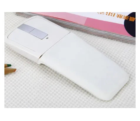 Folded black Bluetooth wireless mouse showing compact 131.2mm length and touch control surface