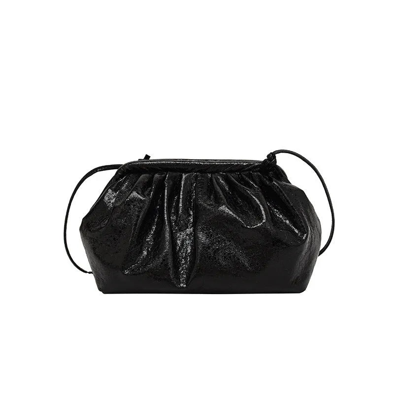 Simple hair clip shoulder crossbody bag in shell shape with sewing line details, shown in rose red colour.