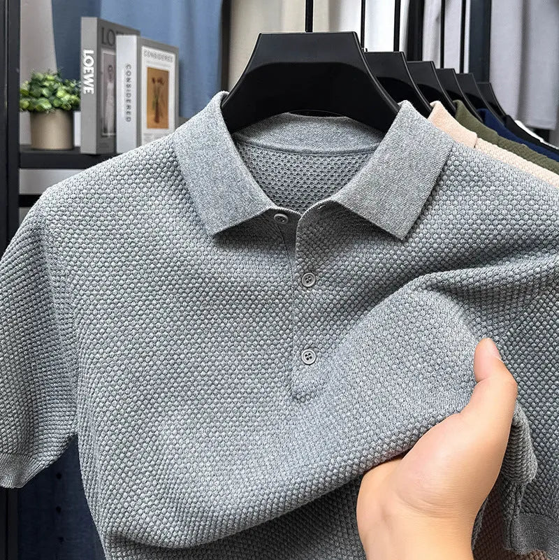 Loose fitting short sleeve cotton sweater in a neutral colour, showing pullover style and casual fit.