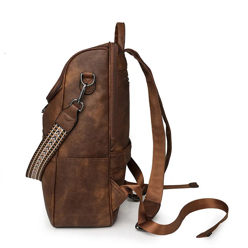 Retro college backpack in PU material with a curved shoulder strap shown in multiple colour options.