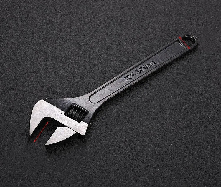 Stainless steel adjustable open-end wrench with blackened finish showing adjustment mechanism and four size options
