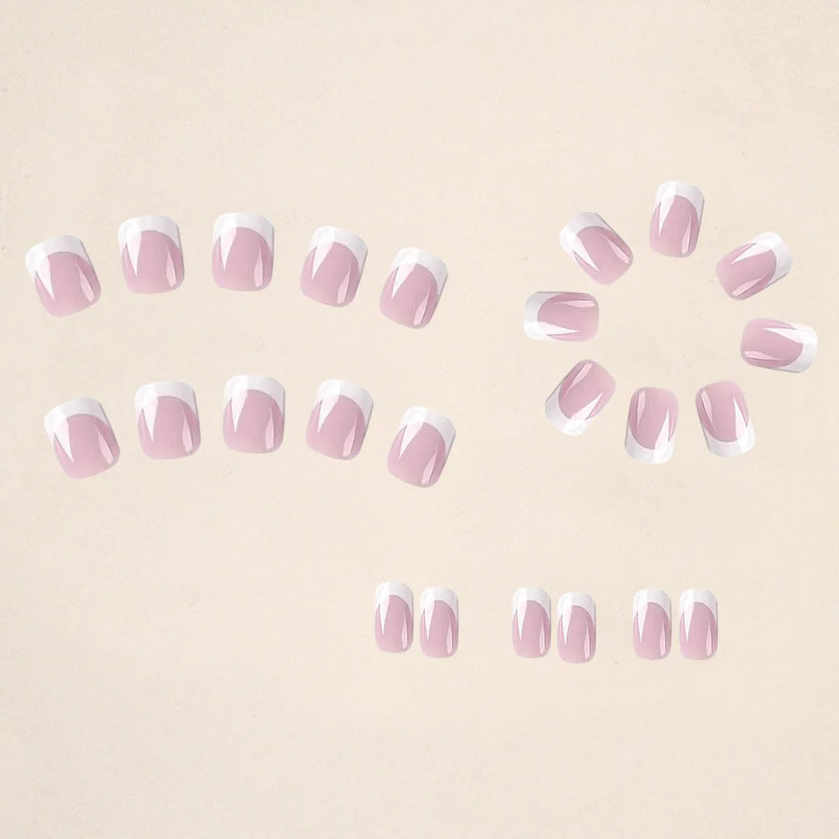 24 white false nail tips with a plaid pattern, laid out on a surface