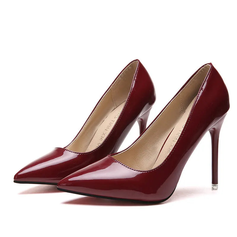 Women's pointed toe pumps with a high stiletto heel in apricot colour on a rubber sole.
