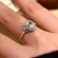 Silver geometric bridal bouquet ring with adjustable opening and diamond-treated elliptical element