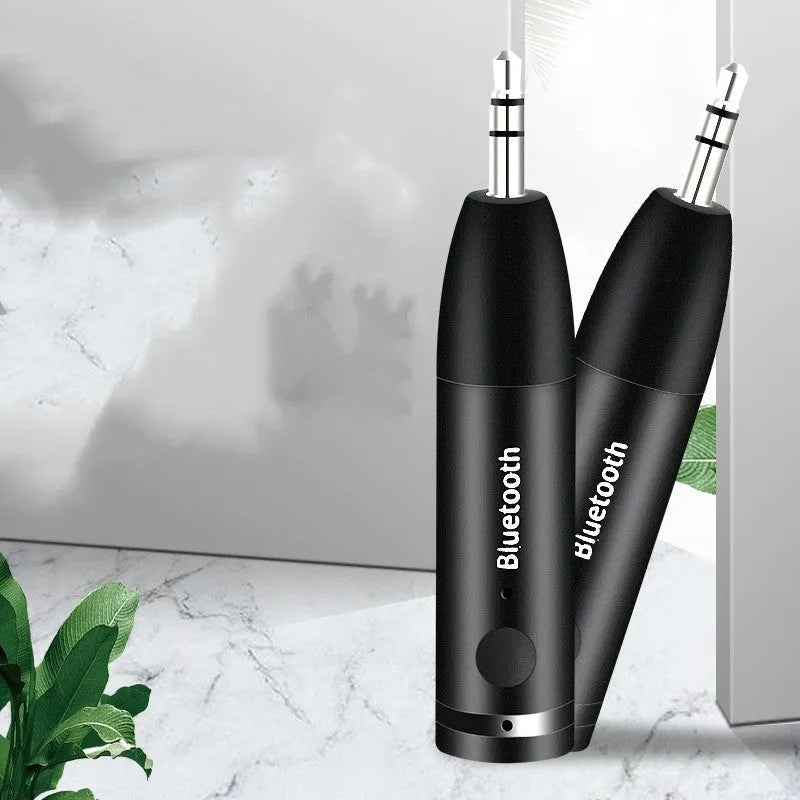 Black Bluetooth audio receiver with AUX cable for car stereo wireless music streaming