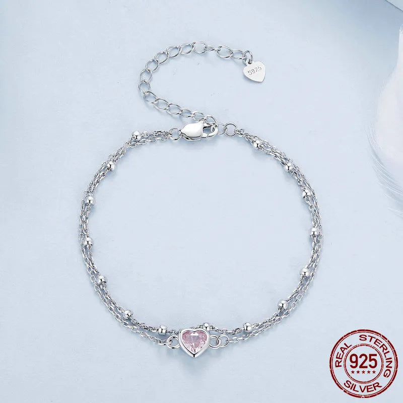 Sweet girlish style 925 sterling silver bracelet with a small heart-shaped charm on an adjustable chain.