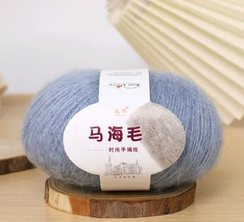 Single ball of mohair yarn in various colours for hand-woven DIY scarf knitting projects