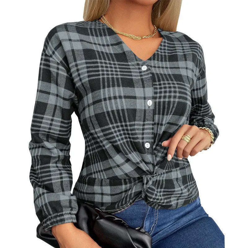 Women's purple loose fit plaid shirt with regular sleeves on a hanger.
