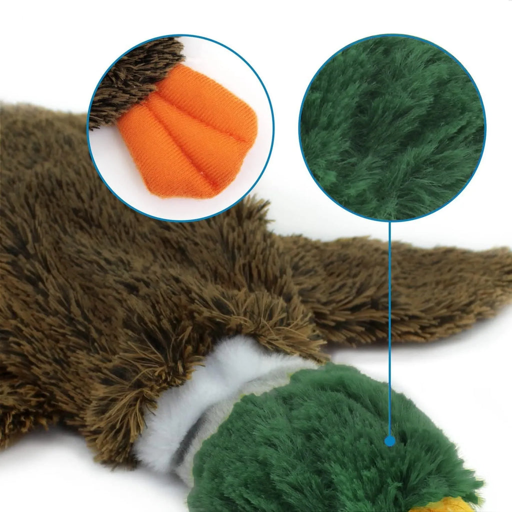 Green stuffless dog toy shaped like a wild duck with two squeakers and bottle cavity opening