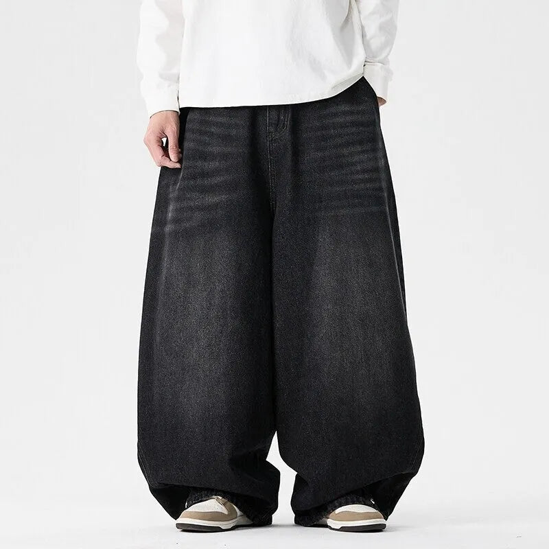 Men's plus size wide leg baggy jeans in black denim with straight leg openings