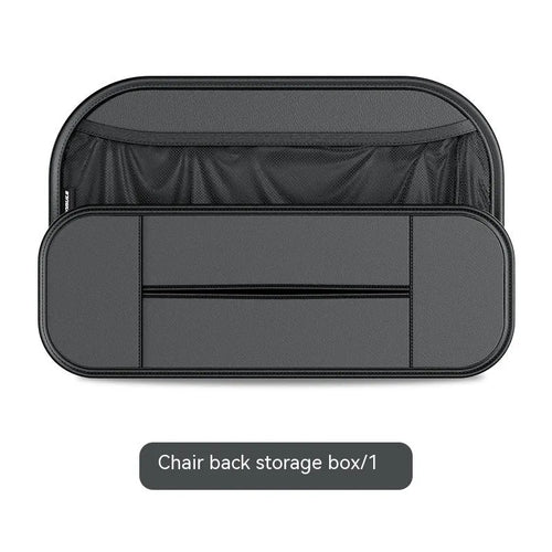 Black leather car seat rear storage bag hanging behind a vehicle seat.