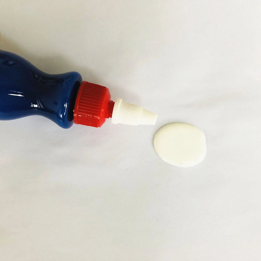 Small blue bottle of 30ml car scratch repair agent with applicator brush for automotive paint touch-ups