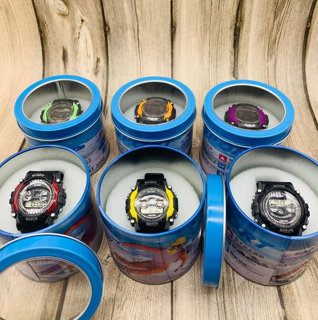 Children's digital sports watch with large black display showing time, red silicone strap, and plastic case
