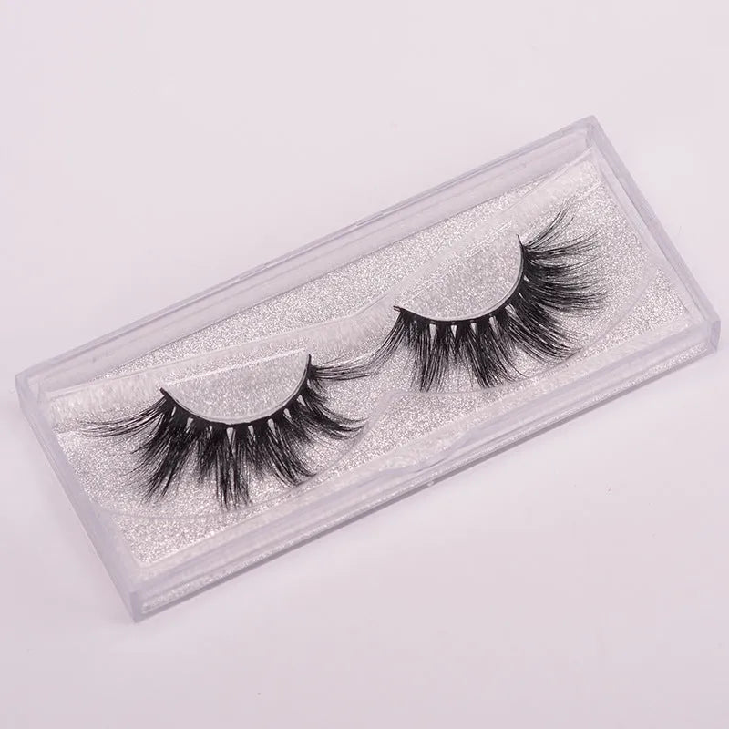 5D mink false eyelashes set with brush and storage cap on pink background